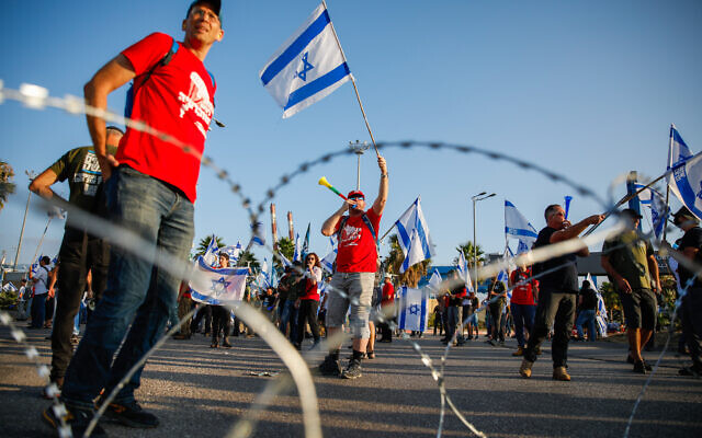 Demonstrators block the entrance to the Haifa port during a protest against the government's planned judicial overhaul, on July 3, 2023. (Shir Torem/Flash90)