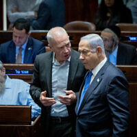 Prime Minister Benjamin Netanyahu (right) and Defense Minister Yoav Gallant (center) attend a vote in the Knesset, July 24, 2023. (Yonatan Sindel/Flash90)