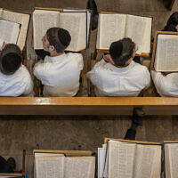 Yeshiva students study at the Kamenitz Yeshiva, in Jerusalem on July 25, 2023. (Chaim Goldberg/Flash90)