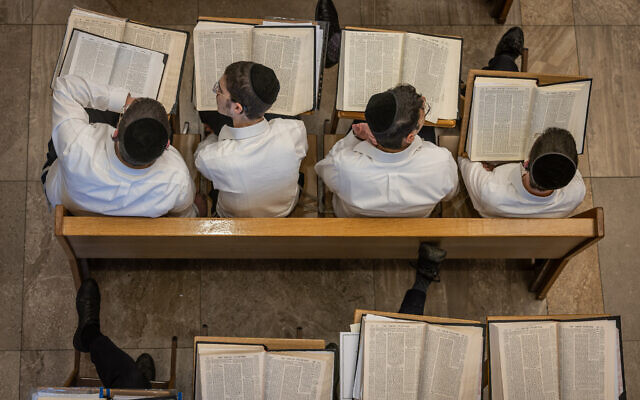 Yeshiva students study at the Kamenitz Yeshiva, in Jerusalem on July 25, 2023. (Chaim Goldberg/Flash90)