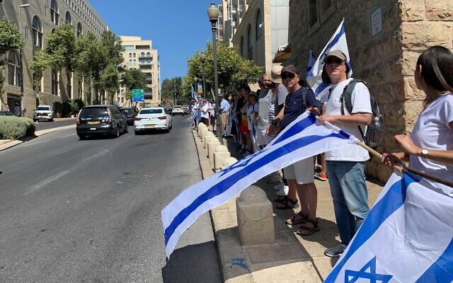 Pro and anti-overhaul demonstrators hold a "unity march," in Jerusalem, July 23, 2023. (Charlie Summers/The Times of Israel)
