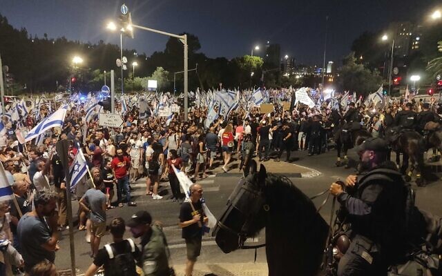 Protesters block a junction in Jerusalem on July 18, 2023. (Michael Bachner/Times of Israel)