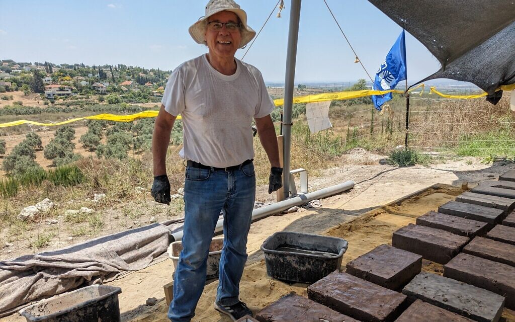 Albert Twizer, a retired computer programmer, pictured here making bricks for Tel Gezer on July 6, 2023, is now a regular volunteer on IAA excavations. (Melanie Lidman/Times of Israel)