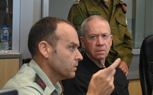 Defense Minister Yoav Gallant (right) is seen with military officers at an IDF operations room during an operation in the West Bank city of Jenin, on July 3, 2023 (Ariel Hermoni/Defense Ministry)