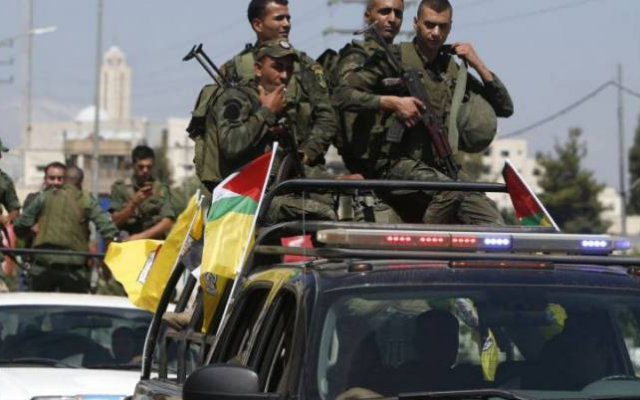 File: Undated image of Palestinian Authority security forces with the Fatah flag. (Hamas-affiliated al-Aqsa TV channel)