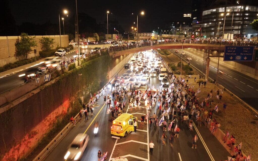 An ambulance at the scene on Highway 531 where a driver rammed into demonstrators, July 24, 2023. (Dov Gazit)