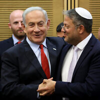 Prime Minister Benjamin Netanyahu, left, greets National Security Minister Itamar Ben Gvir at the Knesset on May 23, 2023. (Gil Cohen-Magen/AFP)
