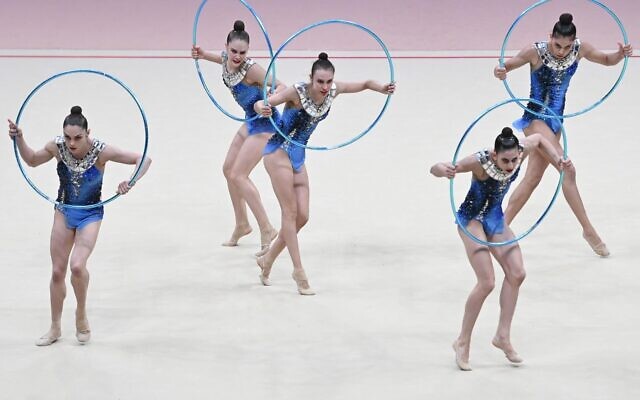 Team Israel compete in the group all-around event of the Olympic qualifier 40th FIG Rhythmic Gymnastics World Championships in Valencia on August 25, 2023. (JOSE JORDAN / AFP)