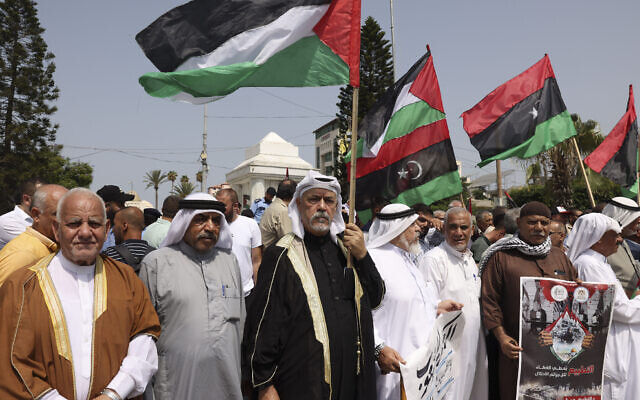 Palestinians rally in Gaza City to express support for Libya on August 31, 2023, after the Libyan foreign minister was fired for meeting with her Israeli counterpart. (Mohammed Abed/AFP)