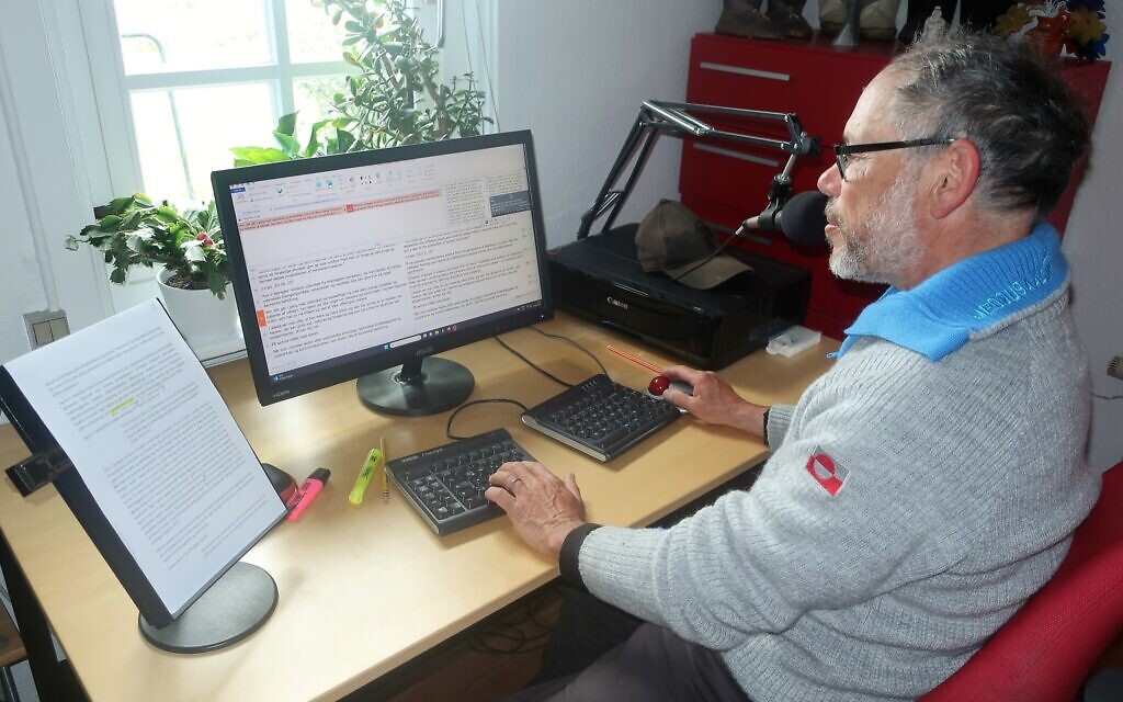 Paul Cohen, likely Greenland's only Jew, works as a translator. Here he's seen translating an academic article from Danish into English. (Dan Fellner/ JTA)