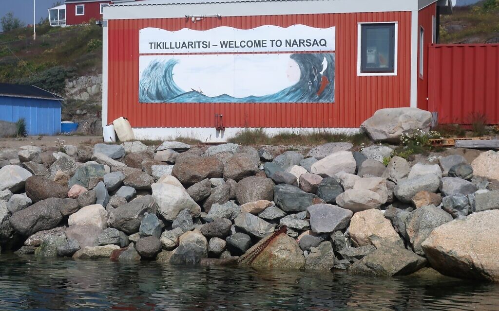 A sign welcomes visitors to Narsaq, Greenland. (Dan Fellner/ JTA)