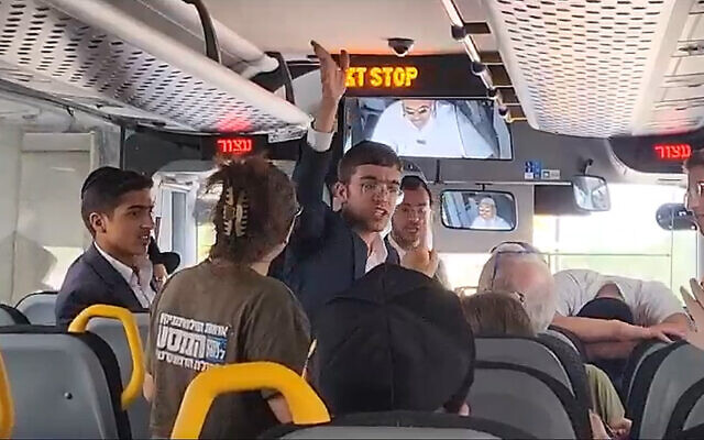 Haredi men and anti-overhaul activists argue aboard a bus bound for Bnei Brak, Israel on Aug. 16, 2023. (Courtesy of Brothers in Arms)