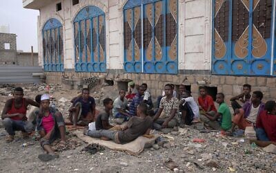 Ethiopian migrants chew Qat where they take shelter on a street in Marib, Yemen, July 30, 2019. (Nariman El-Mofty/AP)