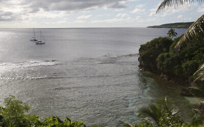 In this Wednesday, June 4, 2014 photo, sailboats sit off the coast near Alofi, Niue. (AP/Nick Perry)