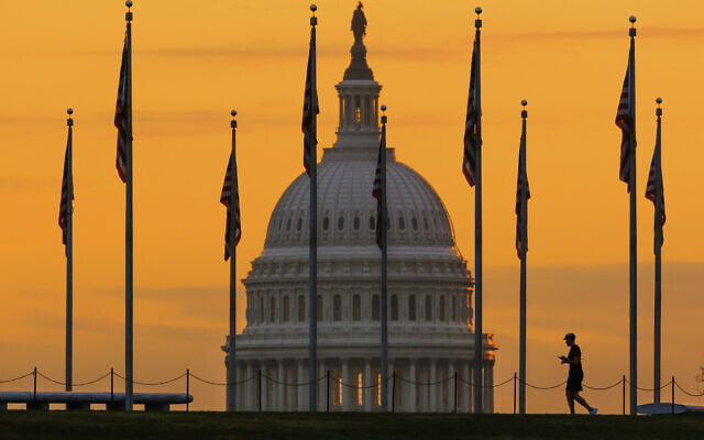 The US Capitol Building looms behind flags on the National Mall in Washington November 7, 2022. (J. David Ake/AP)