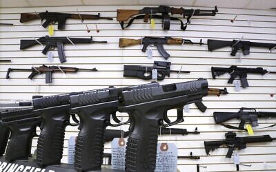Semi-automatic guns are displayed for sale at Capitol City Arms Supply, in Springfield, Illinois, January 16, 2013. (Seth Perlman/AP)