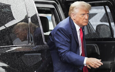 Former US president Donald Trump arrives to board his plane at Ronald Reagan Washington National Airport, Arlington, Virginia, August 3, 2023. (Alex Brandon/AP)