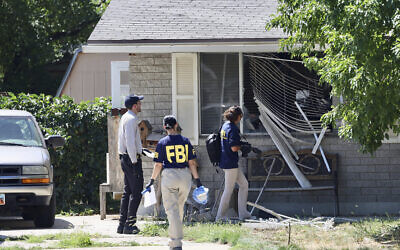 Law enforcement investigate the scene of a shooting involving the FBI, Aug. 9, 2023 in Provo, Utah. (Laura Seitz/The Deseret News via AP)