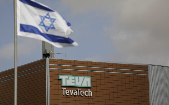 An Israeli flag flies outside a Teva Pharmaceutical Industries building on Dec. 14, 2017, in Neot Hovav, Israel. (AP/Tsafrir Abayov, File)