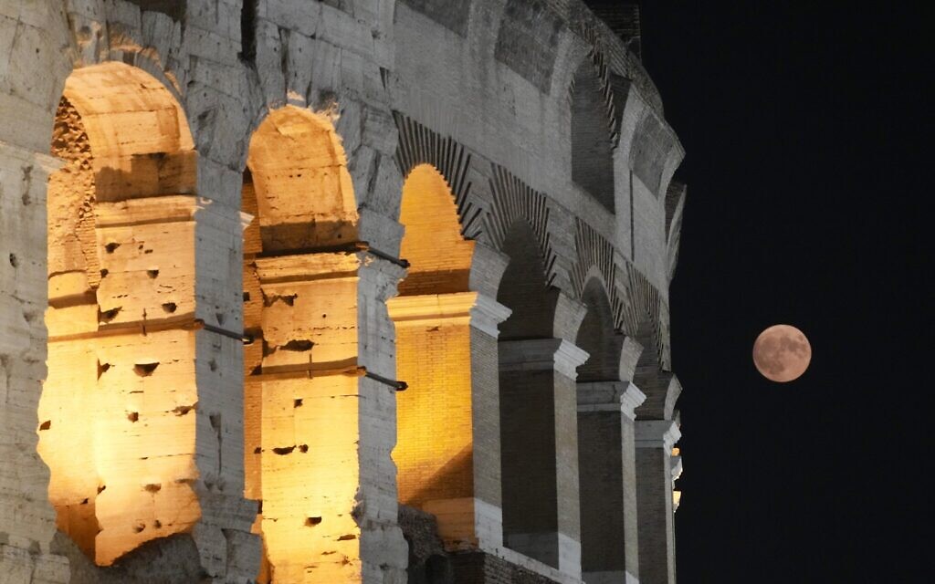 A supermoon rises over the Colosseum in Rome, August 30, 2023. (Gregorio Borgia/AP)