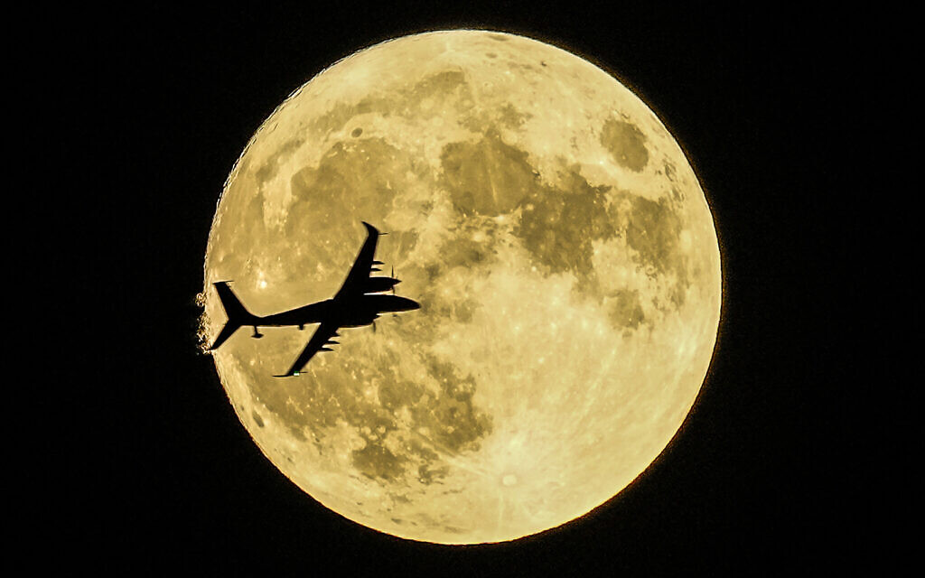Akinci unmanned aerial craft passing in front of the supermoon during a demonstration flight on the first day of Teknofest technology and aerospace festival in Ankara, Turkey, August 30, 2023. (Emrah Gurel/AP)