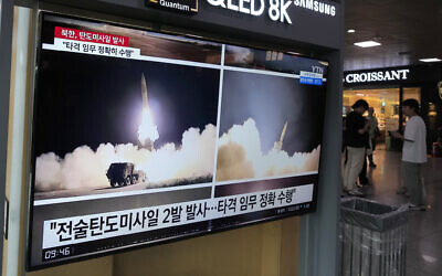 A TV screen shows images of North Korea's missile launch during a news program at the Seoul Railway Station in Seoul, South Korea, August 31, 2023. (AP Photo/Ahn Young-joon)