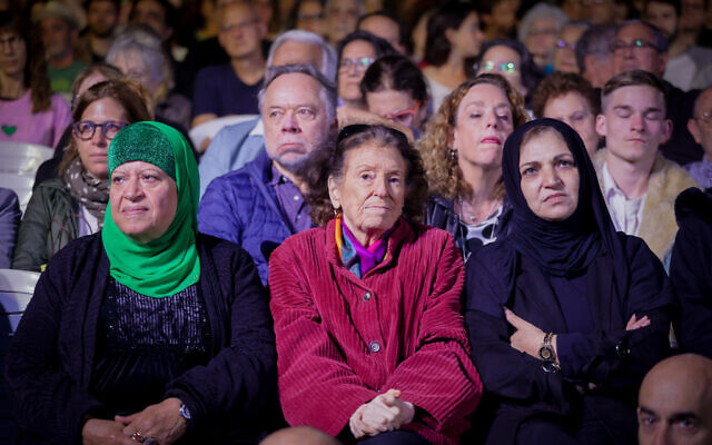 Palestinians and Israelis attend a joint ceremony for families of victims of both sides of the conflict on Israeli Memorial Day, organized by Combatants for Peace and the Parents Circle-Families Forum (PCFF) in Tel Aviv on April 24, 2023. (Itai Ron/Flash90)