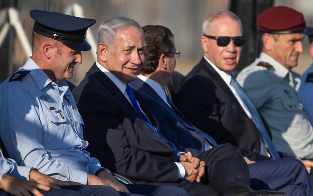 From left, Tomer Bar, Commander of the Israeli Air Force, Prime Minister Benjamin Netanyahu, President Isaac Herzog, Defense Minister Yoav Gallant and IDF Chief of Staff Herzi Halevi at a graduation ceremony for soldiers who have completed the IAF Flight Course, at the Hatzerim Air Base in the Negev Desert, June 29, 2023. (Oren Ben Hakoon/Flash90)