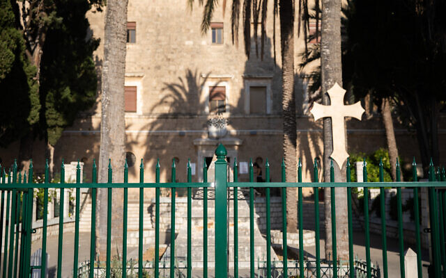 A fence cordon off the front yard of the Stella Maris church in Haifa, Israel  on August 1, 2023. (Shir Torem/Flash90)