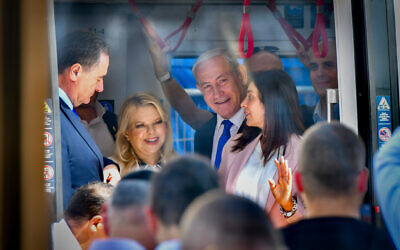 Prime Minister Benjamin Netanyahu, his wife Sara Netanyahu, and other dignitaries at the opening ceremony of the Tel Aviv light rail, in Petah Tikva, August 17, 2023. (Avshalom Sassoni/Flash90)