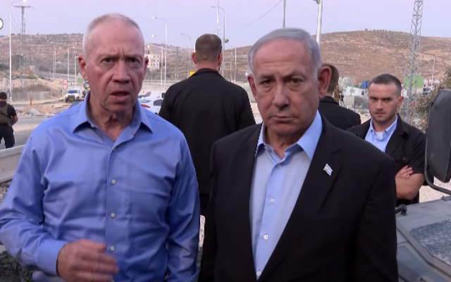 Prime Minister Benjamin Netanyahu (right) and Defense Minister Yoav Gallant issue a statement from the scene of a terror shooting near the West Bank city of Hebron, August 21, 2023. (GPO)
