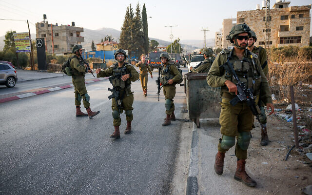 Israeli security forces secure the scene of a shooting attack in Huwara, in the West Bank, August 19, 2023. (Flash90)
