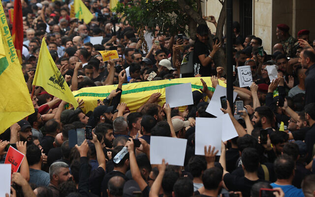 People carry the body of a member of the Lebanese terror group Hezbollah during his funeral in Beirut, on August 10, 2023. (Anwar Amro/AFP)