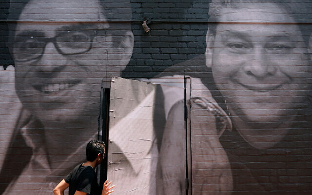 A mural depicting American hostages and wrongful detainees who are being held abroad in Washington, July 20, 2022, in the Georgetown neighborhood of Washington. At left is Siamak Namazi, who has been in captivity in Iran since 2015. At right is Jose Angel Pereira, who has been imprisoned in Venezuela since 2017. (AP Photo/Patrick Semansky, File)