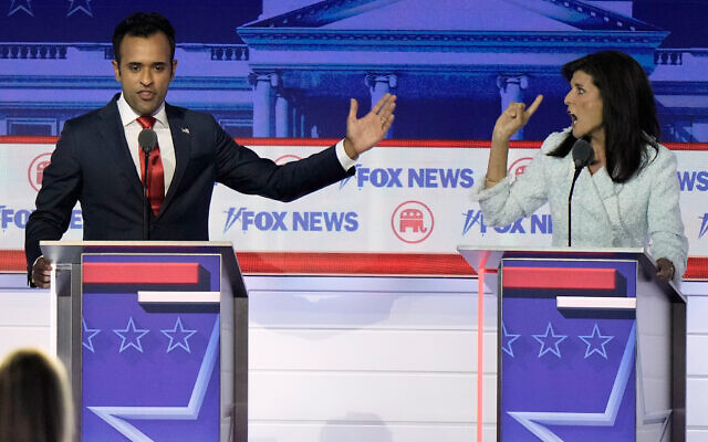 Businessman Vivek Ramaswamy, left, and former UN ambassador Nikki Haley, right, speak during a Republican presidential primary debate hosted by FOX News Channel in Milwaukee, August 23, 2022. (AP Photo/Morry Gash)