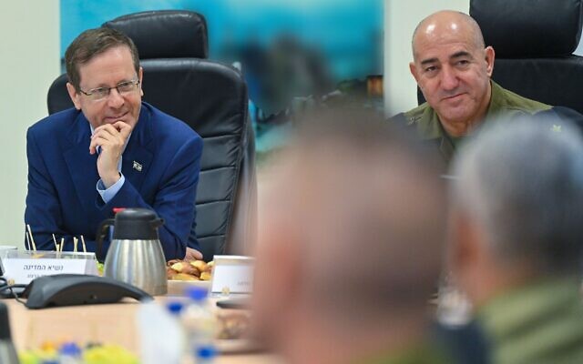 President Isaac Herzog holds a meeting with Navy officials during a visit to the Shayetet 13 naval unit on August 9, 2023. (Kobi Gideon/GPO)