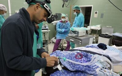 Prof. Ido Didi Fabian performing surgery on a retinoblastoma patient. (Courtesy of Sheba Medical Center)