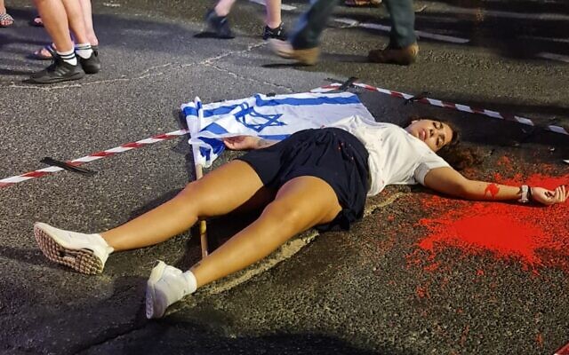 A performance art protest against gender-based violence during the main anti-overhaul rally in Tel Aviv, August 12, 2023. (Doron Margulies)