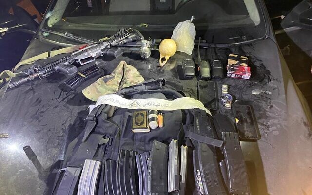 An assault rifle and other military equipment seized from a Palestinian gunman who was wounded and detained after opening fire at troops near Nablus in the northern West Bank, early August 16, 2023. (Israel Defense Forces)