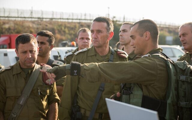 In this handout photo, IDF Chief of Staff Lt. Gen. Herzi Halevi (center) speaks with senior officers at the Maccabim checkpoint near Modiin, August 31, 2023. (Israel Defense Forces)