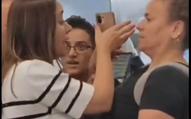 Minister May Golan, left, argues with a protester at Ben-Gurion airport on August 7, 2023. (screen capture: Twitter; used in accordance with Clause 27a of the Copyright Law)
