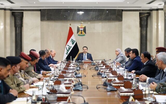 Iraqi Prime Minister Mohammed Shia al-Sudani, center, leads a meeting in Baghdad on August 30, 2023, in a handout photo shared on the premier's X account. (Iraq Prime Minister's spokesperson)