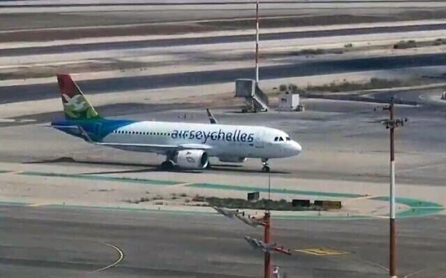 An Air Seychelles plane lands at Ben Gurion International Airport on August 29, 2023, carrying Israeli passengers who were on earlier flight home from the Seychelles that made an emergency landing in Saudi Arabia. (Israel Airports Authority)
