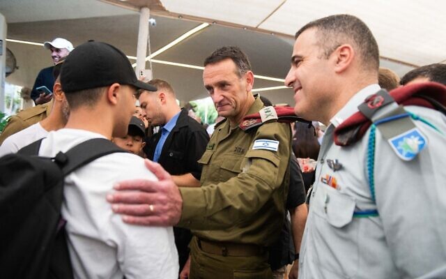 IDF Chief of Staff Lt. Gen. Herzi Halevi (center) speaks with new conscripts at the Tel Hashomer military induction center in Ramat Gan, August 8, 2023. (Israel Defense Forces)