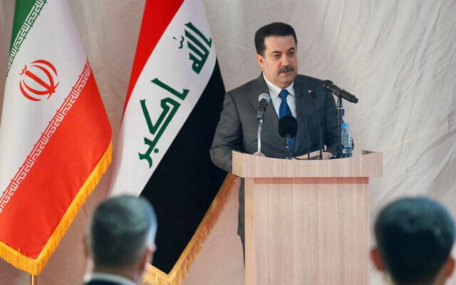 This handout picture released by Iraq's Prime Minister's Media Office shows Prime Minister Mohammed Shia al-Sudani holding a press conference after laying the foundation stone for the railway connection project at the Shalamcheh border crossing in the southern province of Basra Governorate on September 2, 2023. (Photo by IRAQI PRIME MINISTER'S PRESS OFFICE / AFP)