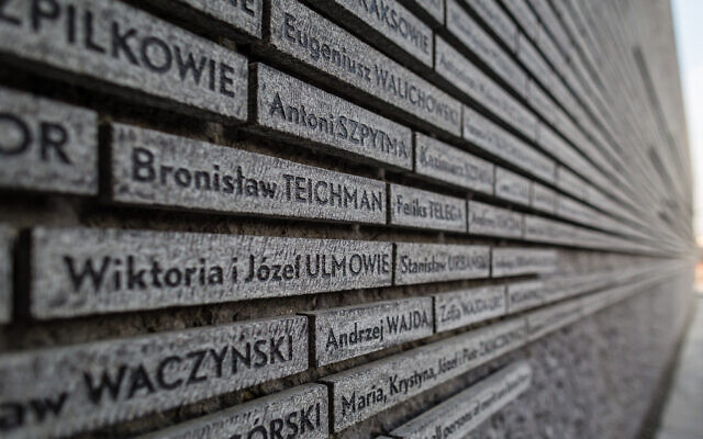 File: The name of the Wiktoria i Jozef Ulma is seen on the wall commemorating Poles who saved Jews during the Holocaust, at the opening ceremony of The Ulma Family Museum Of Poles Saving Jews in World War II in Markowa, Poland, March 17, 2014. (Wojtek Radwanski/AFP)
