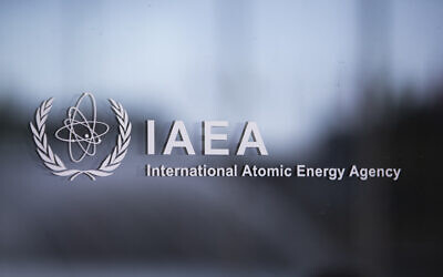 The logo of the International Atomic Energy Agency (IAEA) is pictured on the IAEA building during a meeting of the IAEA Board of Governors at the agency's headquarters in Vienna, Austria, on September 11, 2023. (Alex HALADA / AFP)