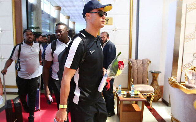This handout picture provided by the media office of Iranian soccer club Persepolis FC on September 18, 2023 shows Saudi soccer club al-Nassr's Portuguese forward Cristiano Ronaldo (front) arriving at Tehran's Imam Khomeini International Airport, a day ahead of the AFC Champions League group E match between Persepolis FC and al-Nassr FC. (Persepolis FC / AFP)