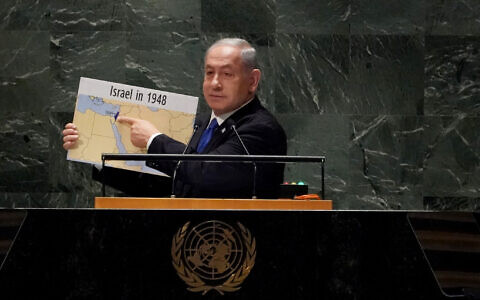 Prime Minister Benjamin Netanyahu shows a map of "Israel in 1948" as he addresses the 78th United Nations General Assembly at UN headquarters in New York City on September 22, 2023. (Photo by Bryan R. Smith / AFP)