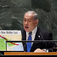 Prime Minister Benjamin Netanyahu uses a red marker on a map of 'The New Middle East' as he addresses the 78th session of the United Nations General Assembly, Friday, Sept. 22, 2023. (Bryan R. Smith / AFP)